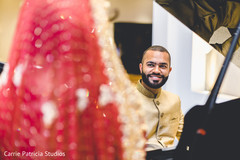 Glamorous Indian groom looking at bride. indian bride and groom's fashion,indian groom's sherwany,indian bride anarkali
