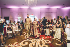 Indian bride and groom entering the wedding reception. Indian bride and groom entering the wedding reception.