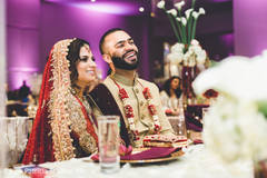 Indian bride and groom at their wedding reception table. Indian bride and groom at their wedding reception table.
