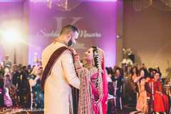 Indian bride and groom looking at each other while dance. Indian bride and groom looking at each other while dance.