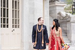See this beautiful indian couple walking holding hands indian wedding gallery,outdoor photography,indian bride and groom,bridal bouquet