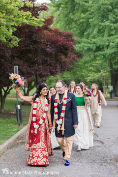 Lovely indian couple followed by their bridal party bridal lengha,indian groom fashion,bridal party fashion