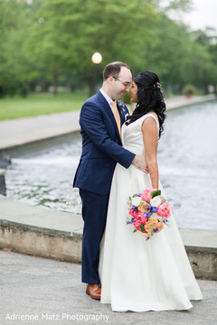 Joyful Indian bride and groom bridal bouquet,white wedding dress,fusion wedding