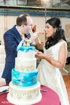 Indian couple tasting their wedding cake wedding cake,indian wedding,cake