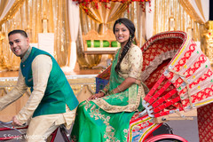 Lovely Indian bride and groom posing in the sangeet sangeet tricycle portrait. Lovely Indian bride and groom posing in the sangeet sangeet tricycle portrait.