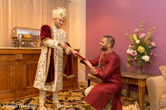 Indian groom getting his wedding sword capture. Indian groom getting his wedding sword capture.