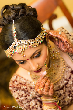 Indian bride showing her Parvathi nose ring. Indian bride showing her Parvathi nose ring.