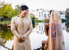 Memorable Indian bride and groom's first look moment. Memorable Indian bride and groom's first look moment.