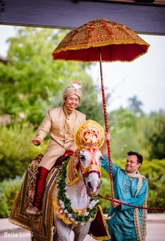 Charming Indian groom on baraat horse capture. indian pre-wedding celebration,baraat procession,baraat,indian groom