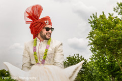 Elegant Indian groom riding baraat white horse. indian groom,indian wedding fashion,baraat,indian pre-wedding celebration