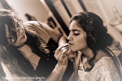 Indian bride getting makeup last touch ups. Indian bride getting makeup last touch ups.