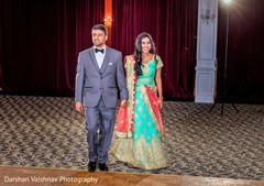 Ravishing Indian bride and groom making their entrance to wedding reception. Ravishing Indian bride and groom making their entrance to wedding reception.