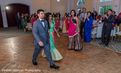 Cheerful couple entrance to wedding reception. Cheerful couple entrance to wedding reception.