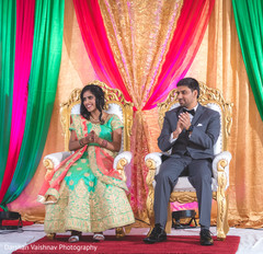 Indian bride and grooms capture during wedding reception speech. indian bride and groom,indian wedding reception fashion,mandap