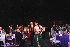 Indian bride and groom's entrance to wedding reception Indian bride and groom's entrance to wedding reception