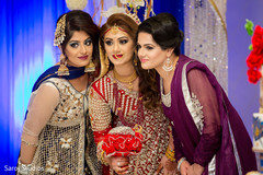 Beautiful indian bride posing with bridesmaids Beautiful indian bride posing with bridesmaids