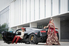 Indian lovebirds posing next to wedding car Indian lovebirds posing next to wedding car
