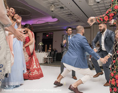 Indian groomsmen showing some dance moves indian wedding reception,indian wedding reception photography