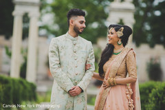 Indian groom admiring bride portrait. Indian groom admiring bride portrait.