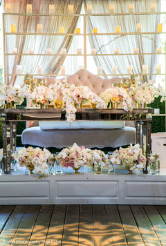 Delightful indian couple's reception table decor indian wedding reception,indian wedding reception floral and decor,floral centerpiece,indian wedding planning and design