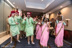 Indian bridesmaids and groomsmen dancing during baraat indian wedding baraat,baraat procession,indian bridesmaids and groomsmen