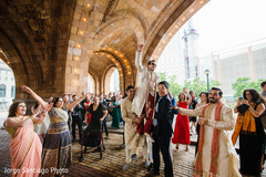 Indian groom being lifted by Indian groomsmen at baraat. indian groom,indian pre-wedding celebration,mandap,indian wedding fashion