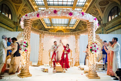 Dazzling Indian bride and groom at their wedding ceremony. indian bride and groom,indian wedding ceremony fashion,mandap