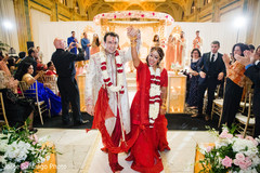Sweet Indian couple at their wedding ceremony. indian bride and groom,indian wedding ceremony fashion,indian wedding decor,mandap