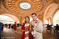 Indian bride and groom exited by showing their wedding rings. indian bride and groom,indian wedding ceremony fashion