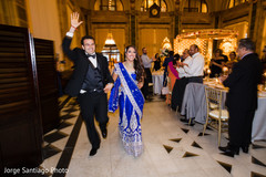 Ravishing Indian bride and groom making their entrance to wedding reception. indian bride and groom,indian wedding reception fashion