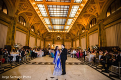 Indian lovebirds having their first dance. indian bride and groom,indian wedding reception fashion,indian wedding first dance