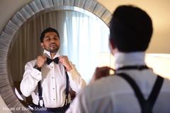 Handsome indian groom getting ready suit,indian groom,getting ready