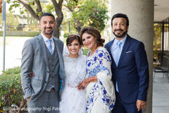 Elegant indian bride and groom with family portrait indian wedding gallery,outdoor photography,indian bride and groom