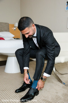 Indian groom putting shoes on indian wedding gallery,indian groom getting ready,indian groom shoes