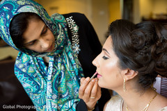 Beautiful indian bride being dolled up for her ceremony Beautiful indian bride being dolled up for her ceremony