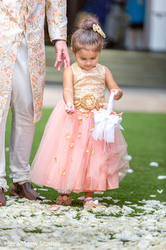 Flower girl throwing away petals Flower girl throwing away petals