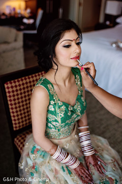 Indian bride getting her makeup done Indian bride getting her makeup done