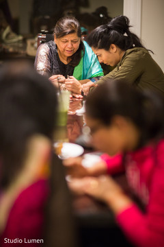 Henna artist making mehndi art Henna artist making mehndi art