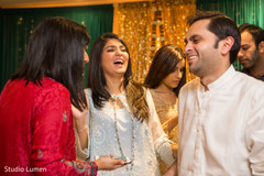 Indian wedding sangeet guests laughing capture Indian wedding sangeet guests laughing capture