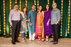 Indian couple with family portrait Indian couple with family portrait