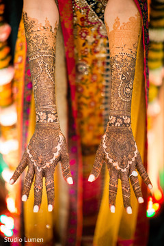 Indian bride showing mehndi art Indian bride showing mehndi art