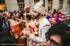 Joyful indian groom dancing during baraat Joyful indian groom dancing during baraat