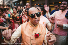 Indian wedding guest dancing during baraat Indian wedding guest dancing during baraat
