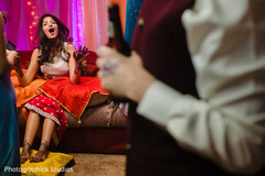 Indian bride getting mehndi art done Indian bride getting mehndi art done