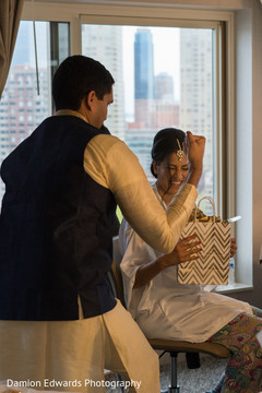 Indian groomsmen delivering a gift to the bride Indian groomsmen delivering a gift to the bride
