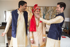 Indian groom getting ready with his groomsmen Indian groom getting ready with his groomsmen