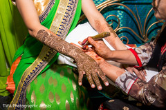 Mehndi artist creating a breutiful design Mehndi artist creating a breutiful design