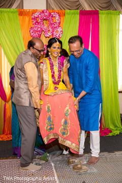 Indian bride being lifted during pithi Indian bride being lifted during pithi