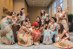 Lovely indian bride posing with bridesmaids Lovely indian bride posing with bridesmaids