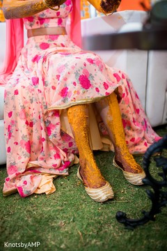 Indian bride being applied turmeric paste Indian bride being applied turmeric paste